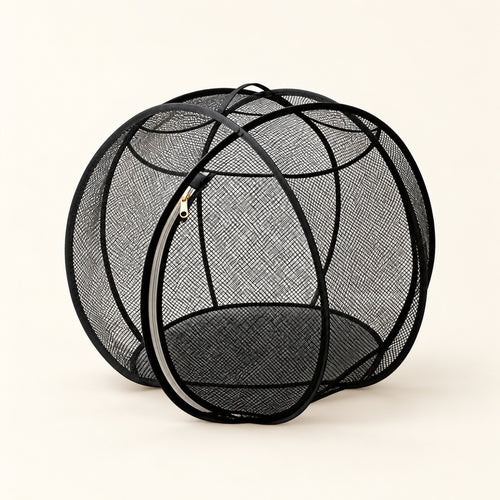 Black Foldable Cat Explorer Sphere: mesh sides, curved frame and oval zip opening on a cream background.